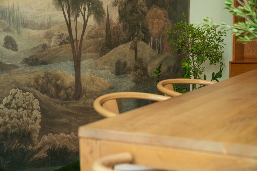 Detail of the hand-painted landscape mural in the Olive Passion showroom