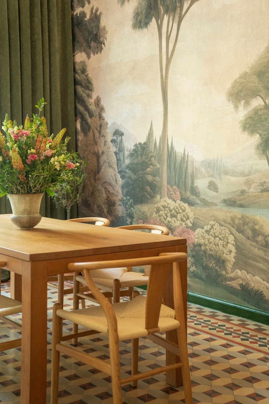 Oak table and woven chairs in the Olive Passion private showroom